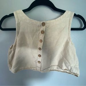 Tan creamish color, cropped, tank top dressy.